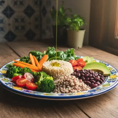 Prato colorido com vegetais variados como tomate, brócolis, cenoura e folhas verdes, representando uma alimentação saudável para a saúde cardiovascular.